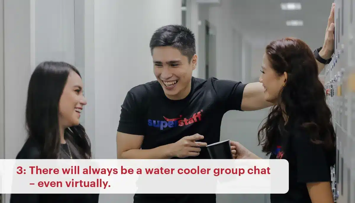 Three SuperStaff employees laugh as they chat. Water cooler chat sessions are part of call center Philippines workplace culture.