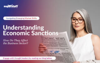 An executive is reading a newspaper. Image caption reads: Understanding Economic Sanctions: How Do They Affect the Business Sector?