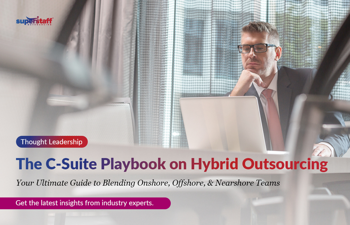 An executive is working. Image caption reads: The C-Suite Playbook on Hybrid Outsourcing.