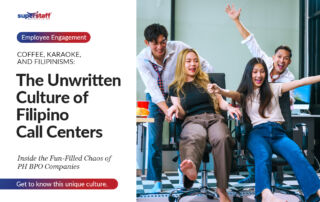 A lively group of four Filipino call center employees is having fun in a modern office setting. Two young women are seated on office chairs, laughing and extending their arms playfully as their male colleagues push them forward. The image conveys camaraderie, teamwork, and the fun side of working in a BPO environment.