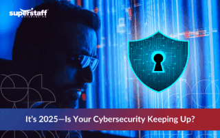 A cybersecurity expert analyzing data with digital shield graphics, representing Cybersecurity in 2025.