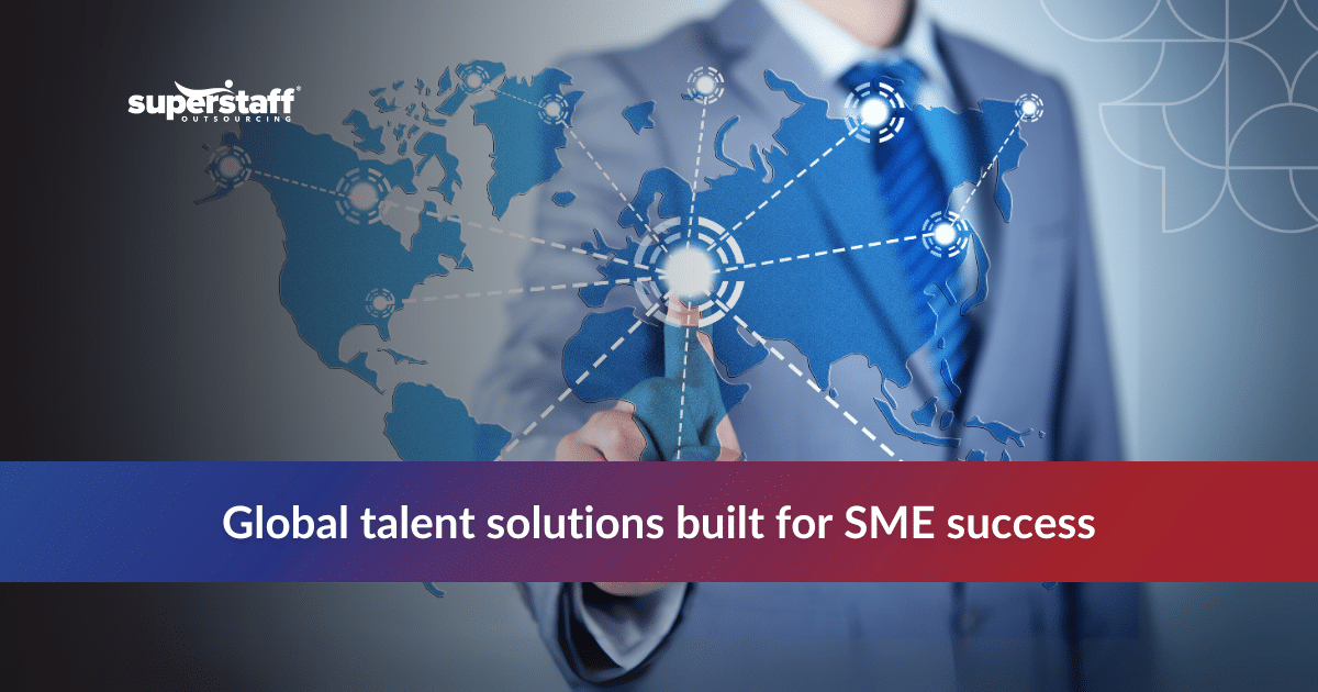 Business professionals shaking hands at a meeting table promoting offshore staffing services to boost SME growth and efficiency.