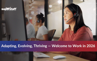 Team collaborating in a modern office representing the future of work 2026 with AI and hybrid models