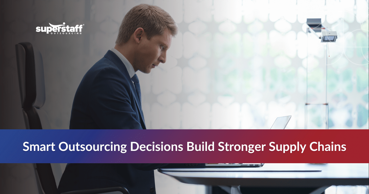 Man working on a laptop symbolizing outsourcing in supply chain management challenges.