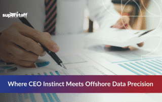 Business professionals performing financial data analysis with charts and documents on desk