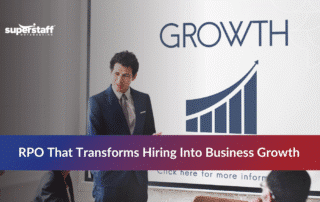 Man leading a team discussion with a growth chart highlighting recruitment process outsourcing benefits