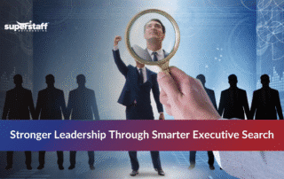 Professional businesswoman in suit representing executive search professionals with modern office background