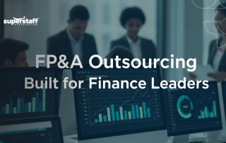 Finance team analyzing FP&A outsourcing reports for strategic planning