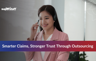 Insurance agents reviewing documents through outsourcing claims processing services