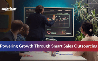 Sales team collaborating to understand different sales outsourcing types