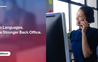 A smiling professional with a headset at her computer, representing efficient back office staffing solutions.
