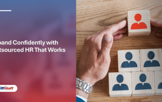 Hands arranging people-icon blocks to build a team hierarchy, representing human resource outsourcing company services.