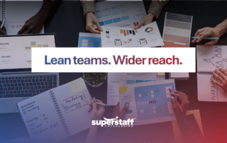 Team collaborating on strategy and data reports for effective outsourcing digital marketing services.