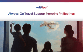 A family looks out an airport window at a flying plane, representing reliable global traveler assistance services.
