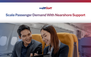 Two corporate travelers smiling inside an airplane cabin, highlighting professional airline support services.