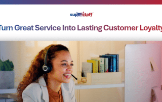 Smiling support agent with headset at a computer, representing a focus on customer loyalty and retention.