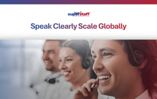 A smiling professional with a headset working at a laptop, representing a skilled bilingual workforce.