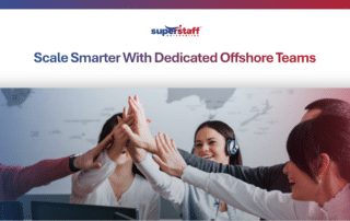 A diverse team celebrating with a high-five, sharing essential offshore outsourcing tips for small business.